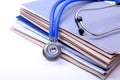 Folder file and stethoscope on the desk Royalty Free Stock Photo