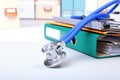 Folder file, stethoscope and note on the desk. blurred background. Royalty Free Stock Photo