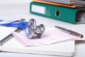 Folder file, stethoscope and RX prescription on the desk. blurred background. Royalty Free Stock Photo