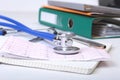 Folder file, stethoscope and RX prescription on the desk. blurred background. Royalty Free Stock Photo