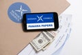 Folder with Mossack Fonseca logo and printed documents with currency