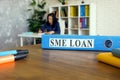Folder with Small Medium Enterprises SME loan documents.