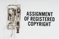 In the folder under a paper clip there is a white sheet with the inscription - Assignment of registered copyright