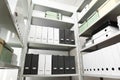 Folders and boxes with documents on shelves in archive