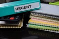 Folders with the label urgent. Business management concept Royalty Free Stock Photo