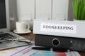 Folders, laptop and documents on desk in office, closeup. Bookkeeper`s workplace Royalty Free Stock Photo