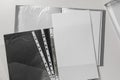 Folders with punched pockets on white table, flat lay Royalty Free Stock Photo