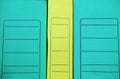Folders-registrators for storing documents are in one row. The yellow folder stands between the green ones. Royalty Free Stock Photo