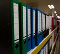 Folders for storing sheets in a row on a shelf Royalty Free Stock Photo