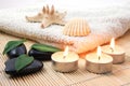 Foldet white bath towel and zen stones Royalty Free Stock Photo