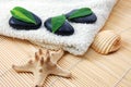 Foldet white bath towel and zen stones Royalty Free Stock Photo