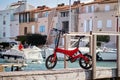 A folding bicycle in the harbor Royalty Free Stock Photo