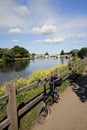 Folding bicycle stands alone near River Thames