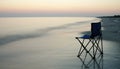 Folding chair on a seaside Royalty Free Stock Photo