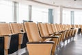 Folding chairs close-up. Big empty modern conference hall in luxury hotel. Audience for Speakers at Business convention Royalty Free Stock Photo