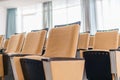 Folding chairs close-up. Big empty modern conference hall in luxury hotel. Audience for Speakers at Business convention Royalty Free Stock Photo