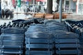 Folding chairs of an outside restaurant, folded up because the place is closed