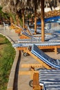 Folding chairs row by swimming pool Royalty Free Stock Photo