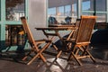 Folding chairs and table outside restaurant