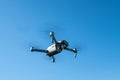 Folding drone DJI Mavic Pro flying in a blue sky Royalty Free Stock Photo