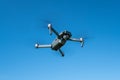 Folding drone DJI Mavic Pro flying in a blue sky Royalty Free Stock Photo