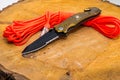 Folding knife with stap cut and cullet. Parachute cord. Royalty Free Stock Photo