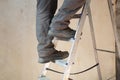 Folding ladder for construction. Stairs for home and office