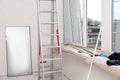Folding ladder, tools and double glazing indoors. Window installation Royalty Free Stock Photo