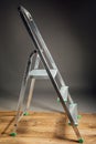 Folding ladder on wooden floor