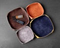 Folding leather valet trays with embossed suede interior for keeping keys