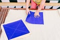 Folding napkins for children is a task to improve the fine motor skills of the hands of the students of montessori schools