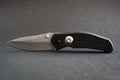 Folding pocket knife isolated on a black background Royalty Free Stock Photo