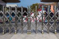 Folding retractable fence on casters. barrier on casters. Sliding gates on rollers. Pedestrian barrier. Barricade Gate. Lockdown