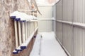 Folding stairs snow. Staircase attached to the wall house in winter.