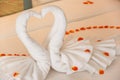 Folding a towel swan for decorations with rose petals