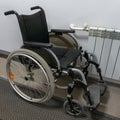 Folding wheelchair. Means of mobility of persons with disabilities