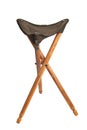 Folding wooden hunting stool tripod isolate on white background. Three-legged camping chair