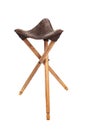 Folding wooden hunting stool tripod isolate on white background. Three-legged camping chair