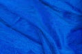 Folds of blue fabric textured background close up Royalty Free Stock Photo