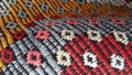 Texture of traditional Turkish ethnic patterned carpet closeup