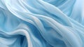 Folds of sky blue silk fabric texture as abstract background wallpaper Royalty Free Stock Photo