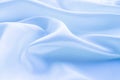 folds of sky blue silk fabric texture background Royalty Free Stock Photo