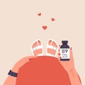 Folic acid. Female hand holding vitamin B9. Top view of pregnancy belly. Risk reducing. Woman taking vitamins for baby Royalty Free Stock Photo