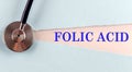 FOLIC ACID word made on torn paper, medical concept background