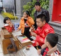 The folk artist make traditional chinese dough doll