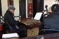 Folk artist who is playing Chinese national musical instruments