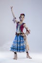 Folk Ballet Ideas. Young Japanese Female Ballet Dancer In Stage Outfit Costume Posing in Dance Pose With Patterns On White