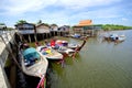 Folk house and folk ship on a quiet waterfront.