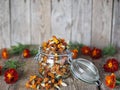 Folk medicine.Glass storage jar with medicinal dried red flowers of black marigolds on a wooden background.The benefits of Royalty Free Stock Photo