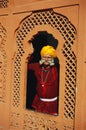 Folk musician standing in window , Rajasthan , India MR#657 Royalty Free Stock Photo